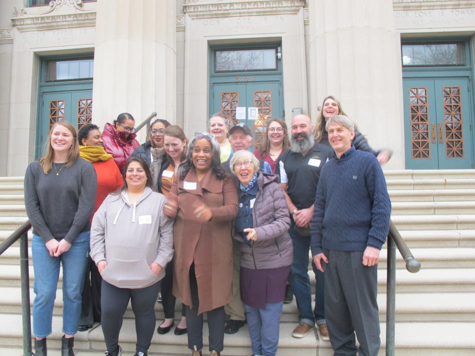 The Wisconsin 14 gather in front of the Wisconsin Masonic Center in Madison, where they spent multiple days trying to come to consensus on abortion and family well-being