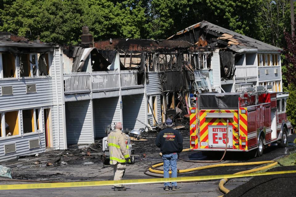 The Maine state fire marshal and Kittery Fire Department investigate Thursday, May 18, 2023, a day after a five-alarm-plus ravaged the Days Inn at 85 Route 1 Bypass in Kittery.