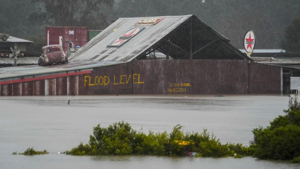 Flood waters surround an industrial property in Londonderry on the outskirts of Sydney, Australia, Monday, July 4, 2022. 