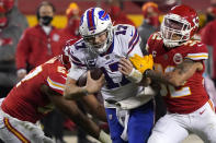 Buffalo Bills quarterback Josh Allen (17) is tackled by Kansas City Chiefs safety Tyrann Mathieu (32) during the second half of the AFC championship NFL football game, Sunday, Jan. 24, 2021, in Kansas City, Mo. (AP Photo/Jeff Roberson)