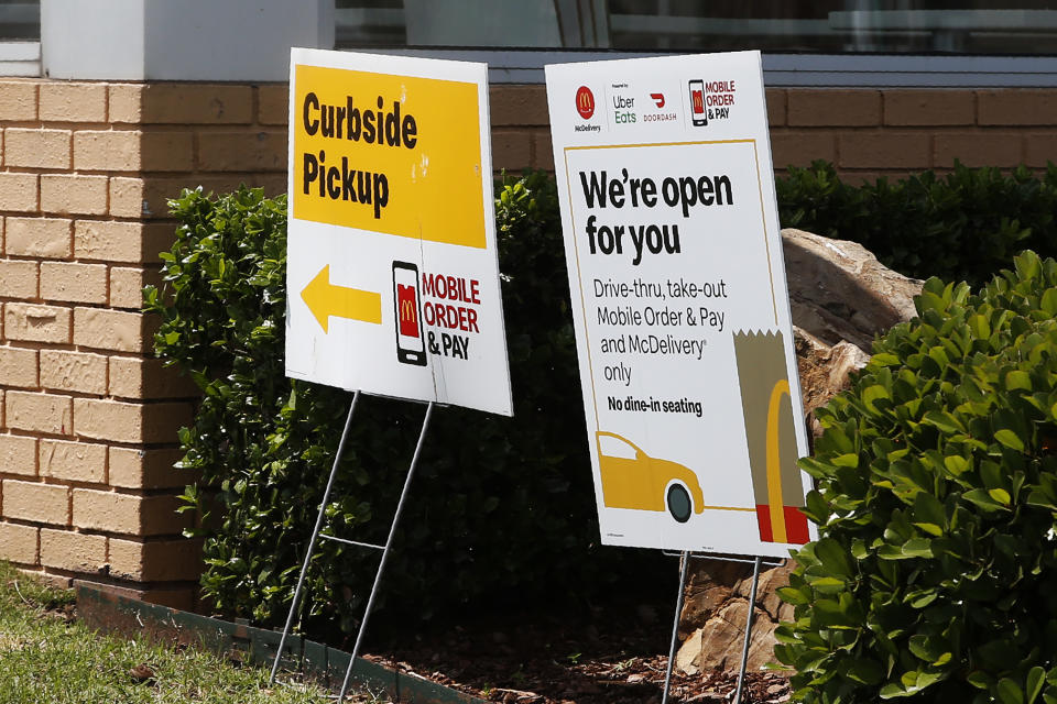 A sign at a McDonald's restaurant states no dine-in seating Thursday, May 7, 2020, in Oklahoma City, where three McDonald's employees suffered gunshot wounds when a customer opened fire because she was angry that the restaurant's dining area was closed because of the coronavirus pandemic, on Wednesday. (AP Photo/Sue Ogrocki)