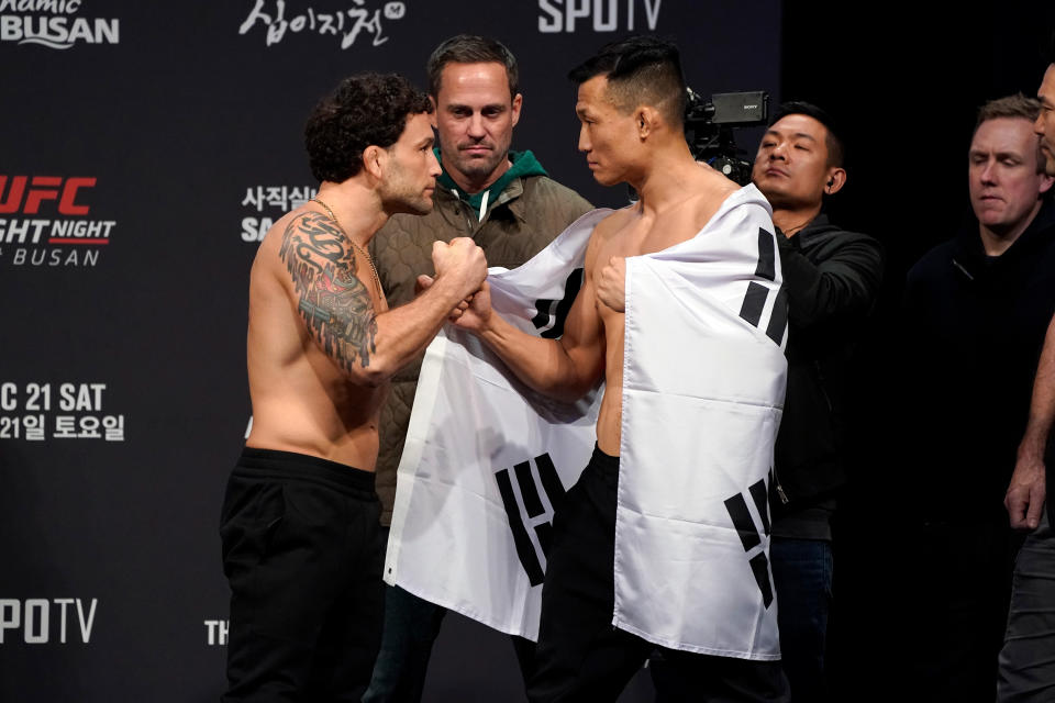 BUSAN, SOUTH KOREA - DECEMBER 20:  (L-R) Frankie Edgar and Chan Sung Jung of South Korea face off during the UFC fight night weigh-in at Sajik Arena on December 20, 2019 in Busan, South Korea. (Photo by Jeff Bottari/Zuffa LLC via Getty Images)