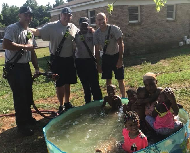 The firemen got their hose out to fill up the family’s kiddie pool with water. (Photo: Facebook/CHARLOTTE FIRESTATION 18)