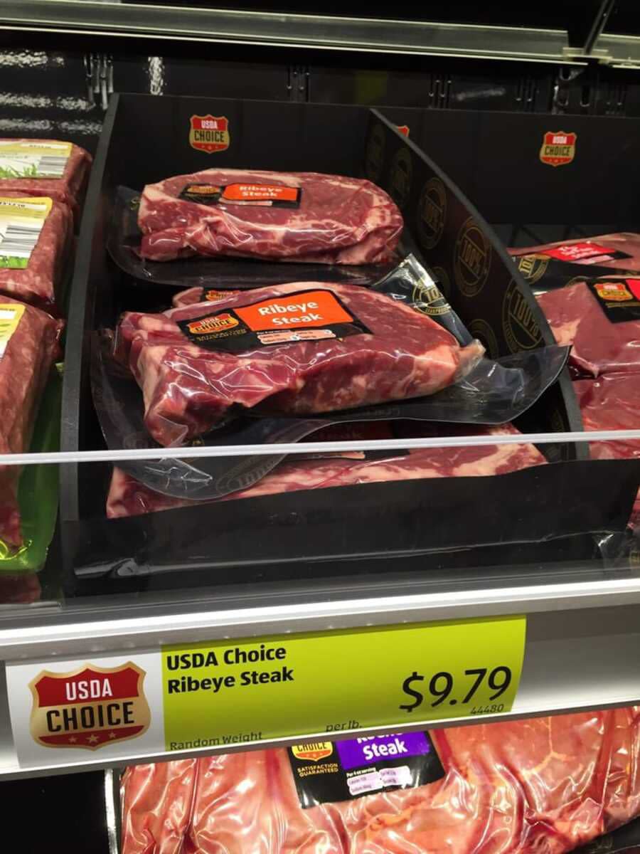 USDA Choice Ribeye Steak for sale in the refrigerated meat section at Aldi, Arcadia, California, other meats for sale left, right, and bottom of it