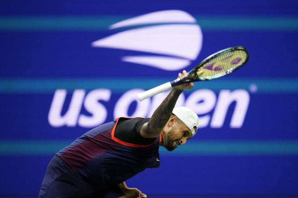 Nick Kyrgios, of Australia, tosses his racket as he plays Karen Khachanov, of Russia, during the quarterfinals of the U.S. Open tennis championships, Tuesday, Sept. 6, 2022, in New York. (AP Photo/Charles Krupa)