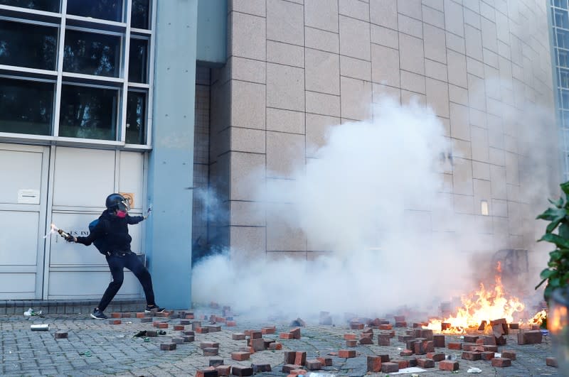 Protesters clash with police outside Hong Kong Polytechnic University (PolyU) in Hong Kong