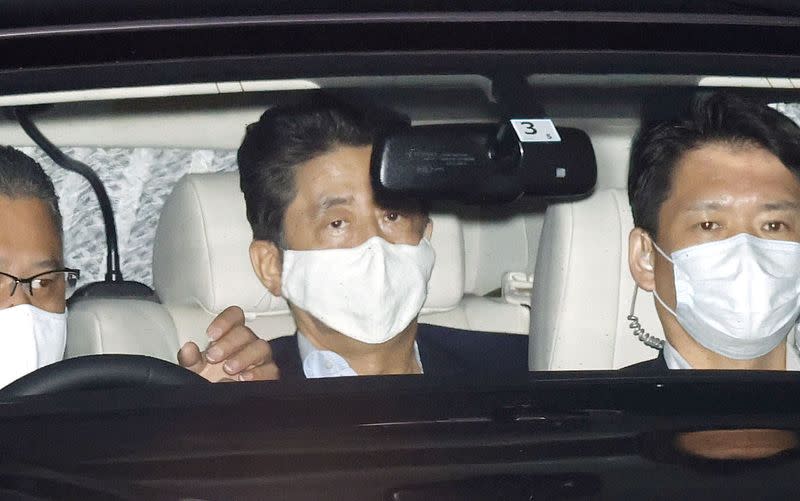 Japanese Prime Minister Shinzo Abe arrives at his residence as he returns from Keio University Hospital in Tokyo