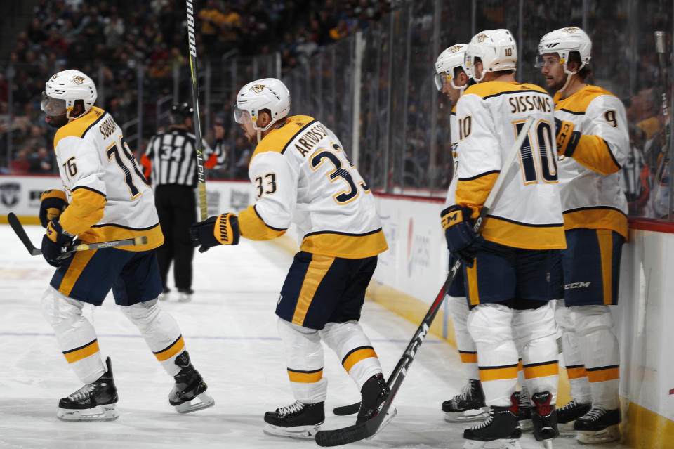 Nashville Predators right wing Viktor Arvidsson, second from left, celebrates scoring a goal with, from left, defenseman P.K. Subban, center Colton Sissons and left wing Filip Forsberg in the second period of an NHL hockey game against the Colorado Avalanche, Monday, Jan. 21, 2019, in Denver. (AP Photo/David Zalubowski)