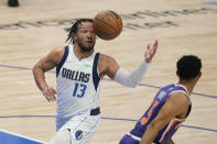 Dallas Mavericks guard Jalen Brunson (13) drives to the basket past Phoenix Suns guard Cameron Payne, right, during the second half of Game 3 of an NBA basketball second-round playoff series, Friday, May 6, 2022, in Dallas. (AP Photo/Tony Gutierrez)