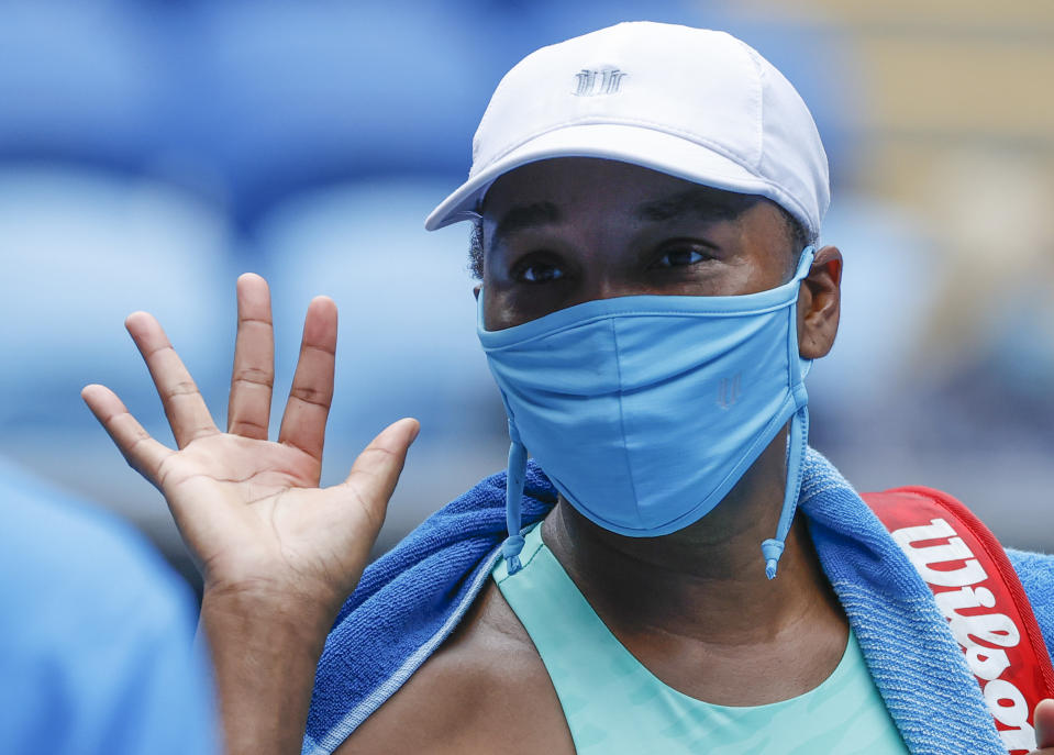 United States' Venus Williams waves after defeating Belgium's Kirsten Flipkens in their first round match at the Australian Open tennis championship in Melbourne, Australia, Monday, Feb. 8, 2021.(AP Photo/Rick Rycroft)