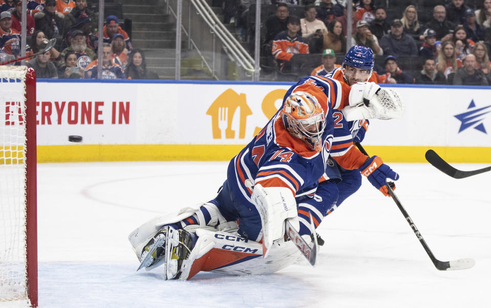 Edmonton Oilers goalie Stuart Skinner gives up a goal to the Carolina Hurricanes during the third period of an NHL hockey game Wednesday, Dec. 6, 2023, in Edmonton, Alberta. (Jason Franson/The Canadian Press via AP