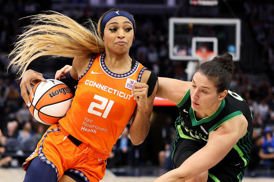 Oct. 1, 2024; Minneapolis, Minnesota, USA; Connecticut Sun guard DiJonai Carrington (21) works around Minnesota Lynx forward Cecilia Zandalasini (9) during the second half of Game 2 of the 2024 WNBA Semifinals at Target Center. Mandatory Credit: Matt Krohn-Imagn Images TPX IMAGES OF THE DAY