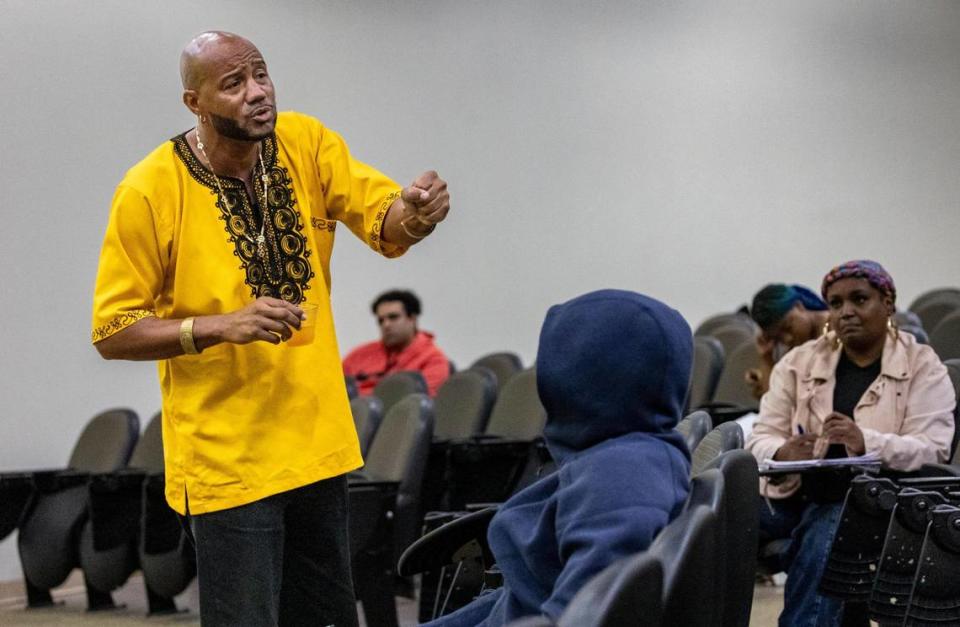 Professor Msomi Moor, left, as he teaches his African American studies class at Florida Memorial University.