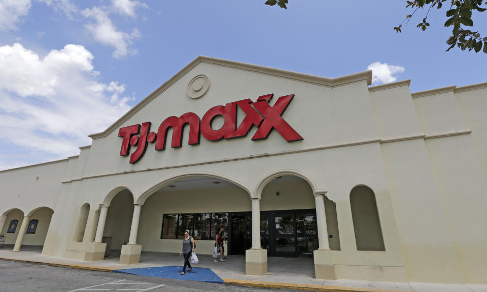 TJ Maxx’s parent company will be among the notable companies reporting earnings on Tuesday. (AP Photo/Alan Diaz)