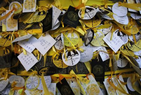 Messages by pro-democracy protesters are left on circular notes featuring an umbrella illustration outside the Legislative Council in Hong Kong October 10, 2014. REUTERS/Bobby Yip