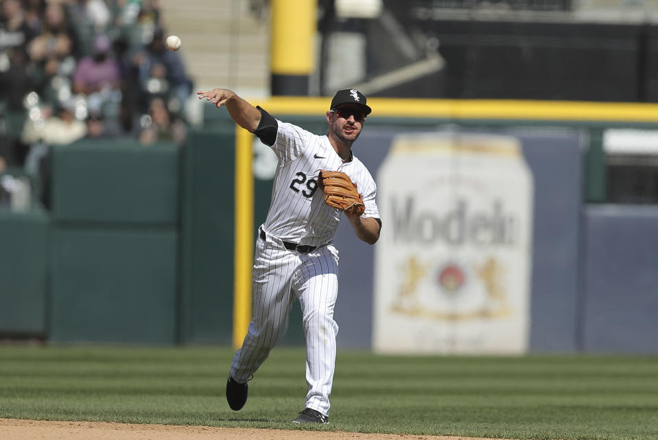 Chicago White Sox's Paul DeJong throws the ball to first base for an out during the sixth inning of a baseball game against the Cincinnati Reds, Saturday, April 13, 2024, in Chicago. (AP Photo/Melissa Tamez)