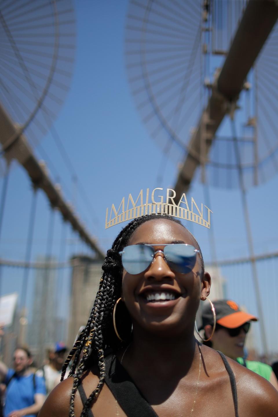 <p>Demonstrators cross the Brooklyn Bridge as they march against the separation of immigrant families, on June 30, 2018 in New York. (Photo: Eduardo Munoz Alvarez/AFP/Getty Images) </p>