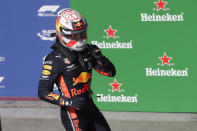 Red Bull driver Max Verstappen, of the Netherlands, celebrates after taking pole position during the qualifying session for the Formula One Brazil Grand Prix at the Interlagos race track in Sao Paulo, Brazil, Saturday, Nov. 16, 2019. (AP Photo/Silvia Izquierdo)