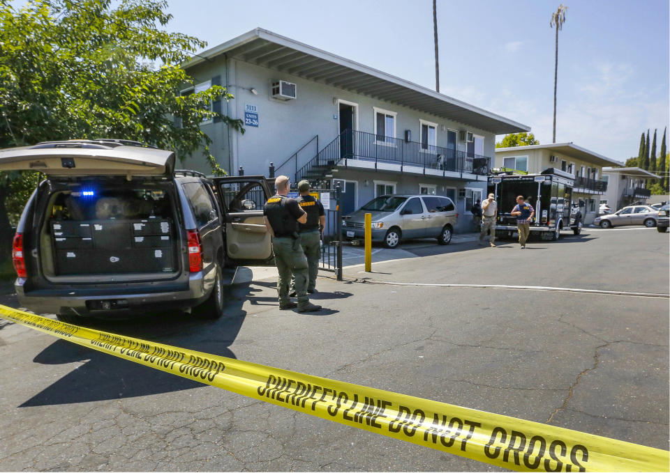 FILE - In this Aug. 15, 2018, file photo, police crime scene tape blocks the entrance to an apartment complex following the arrest of a 45-year-old Iraqi refugee Omar Ameen in Sacramento, Calif. A federal judge in California refused Wednesday, April 21, 2021, to allow the extradition to Iraq of Ameen, accused of killing for the Islamic State, saying cellphone evidence shows he was in Turkey at the time of the slaying. The U.S. Justice Department has tried since 2018 to return Omar Abdulsattar Ameen to Iraq under a treaty with that nation. (AP Photo/Rich Pedroncelli, File)