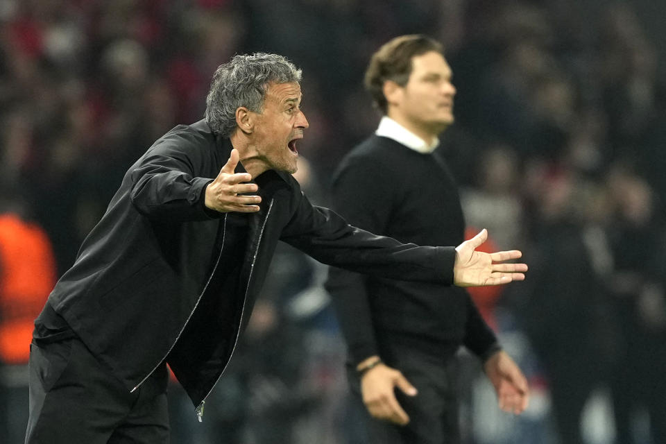 PSG's head coach Luis Enrique, left, and Dortmund's head coach Edin Terzic during the Champions League semifinal second leg soccer match between Paris Saint-Germain and Borussia Dortmund at the Parc des Princes stadium in Paris, France, Tuesday, May 7, 2024. (AP Photo/Lewis Joly)