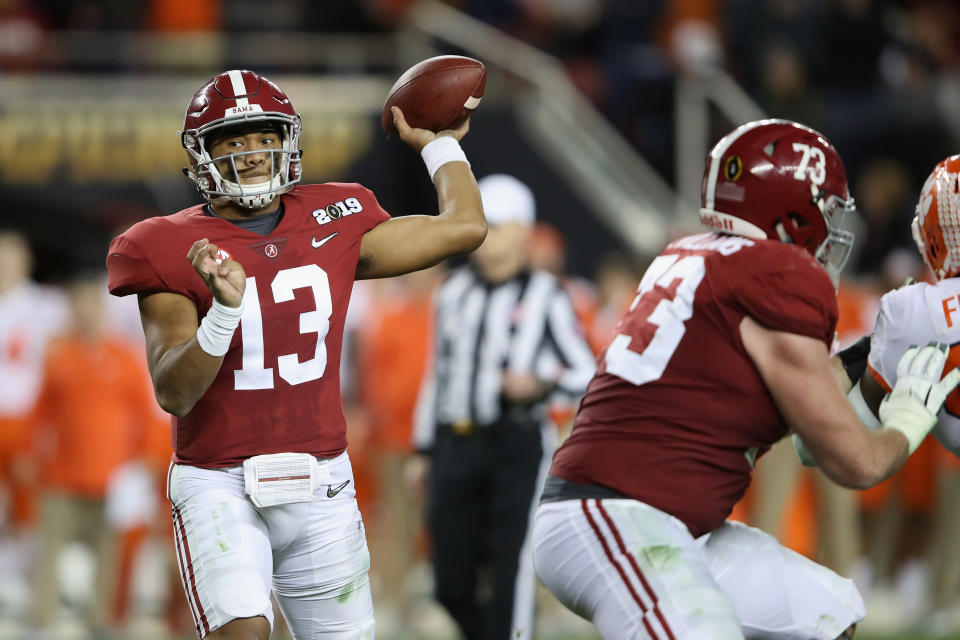 Tua Tagovailoa (13) of the Alabama Crimson Tide attempts a pass against the Clemson Tigers in the CFP title game on Jan. 7. (Getty)