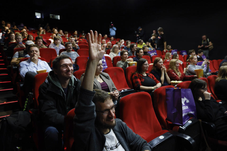 People fill a movie theatre to watch a speech to parliament by outgoing Polish Prime Minister Mateusz Morawiecki in Warsaw, Poland, Monday, Dec. 11, 2023. A movie theater in Warsaw is offering screenings of live proceedings in parliament, which have aroused huge interest in Poland as the country transitions from a conservative right-wing government to a centrist government. (AP Photo/Michal Dyjuk)