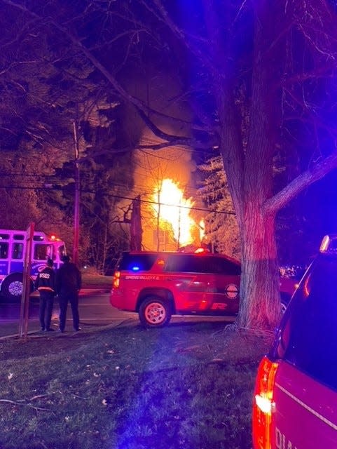 Firefighters battle flames to a house illegally used as a boarding house at 510 Chestnut Ridge Road in Chestnut Ridge