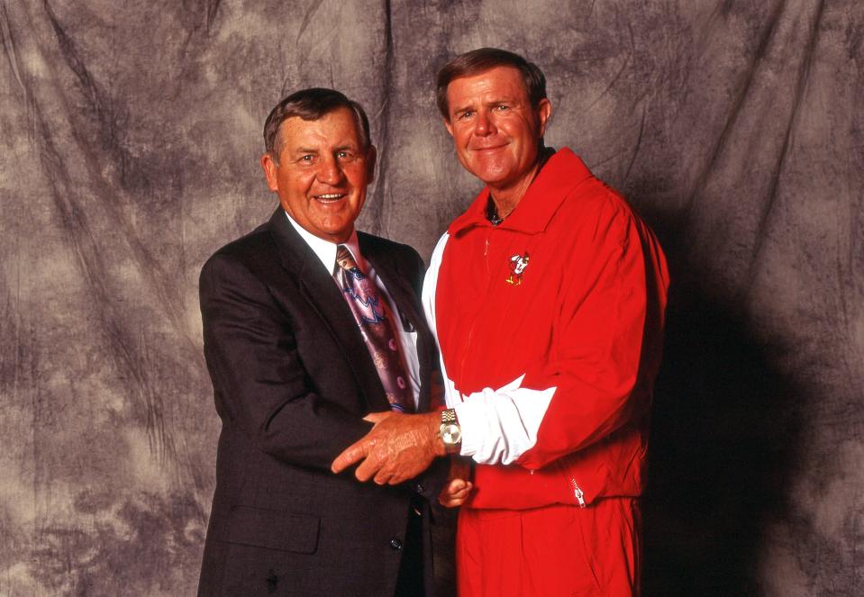 Louisville men's basketball assistant coach Jerry Jones, left, poses for a picture with Hall of Fame head coach Denny Crum. Jones died Monday at age 89.