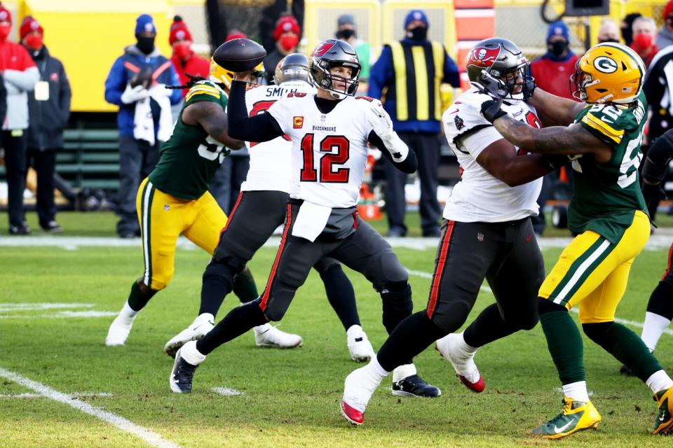 Quarterback Tom Brady of the Tampa Bay Buccaneers looks to pass in the second quarter