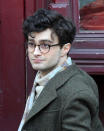 Daniel Radcliffe has become known for the circle-shaped glasses he wore in "Harry Potter," but the actor's new movie look, which was captured on the Brooklyn set of "Kill Your Darlings" in March, includes tortoise frames ... and some very curly locks.