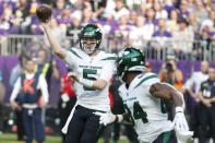 New York Jets quarterback Mike White (5) throws a pass to wide receiver Corey Davis, right, during the first half of an NFL football game against the New York Jets, Sunday, Dec. 4, 2022, in Minneapolis. (AP Photo/Bruce Kluckhohn)