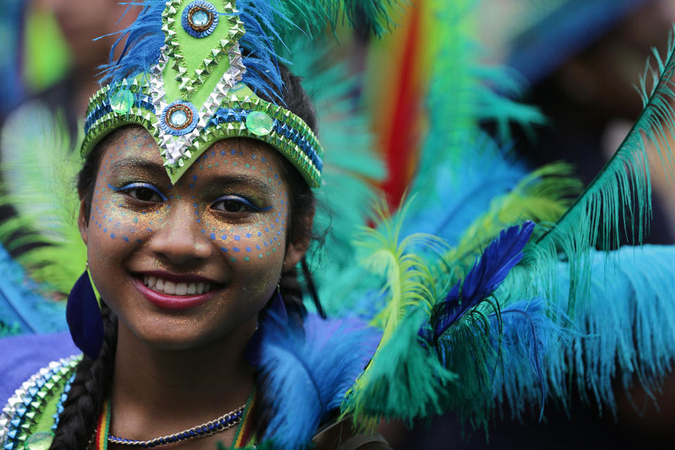 <p>Performers in costume pose on the first day of the Notting Hill Carnival in west London on August 28, 2016. (Photo: DANIEL LEAL-OLIVAS/AFP/Getty Images) </p>