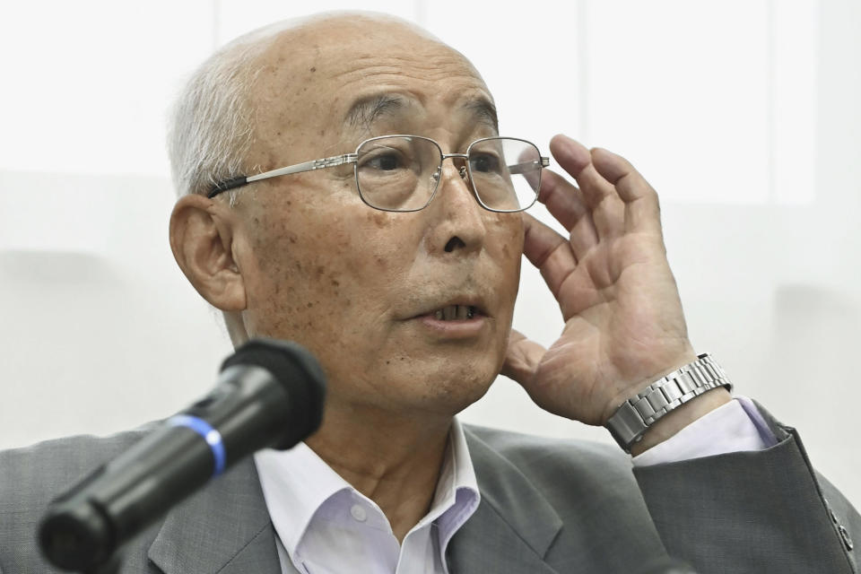 Tetsuo Nishi, mayor of Kaminoseki, a town in Japan's southwestern prefecture, speaks to reporters at the town hall in Kaminoseki town, Japan, Friday, Aug. 18, 2023, after announcing that it will accept a geological feasibility study as a potential site to build an interim storage for spent nuclear fuel. (Kyodo News via AP)