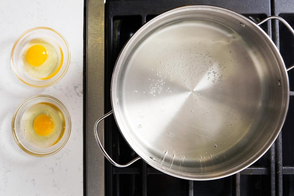 Some people swear that to get perfect poached eggs, you need to add vinegar to the water. Don't listen to them. What's important is using fresh eggs—they hold their shape better than older ones. The water temperature is also key: You aren't looking for a rolling boil or even a simmer here. (All that motion will shake and possibly break your egg.) Instead, heat a large pot of salted water over high until you start to see tiny bubbles appear on the bottom (the temperature should be around 180°F). Reduce heat to very low to keep it there, or, if you need to, remove the pot from the heat altogether.