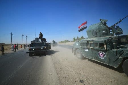 Members of Iraqi federal forces gather to continue to advance in military vehicles in Kirkuk, Iraq October 16, 2017. REUTERS/Stringer