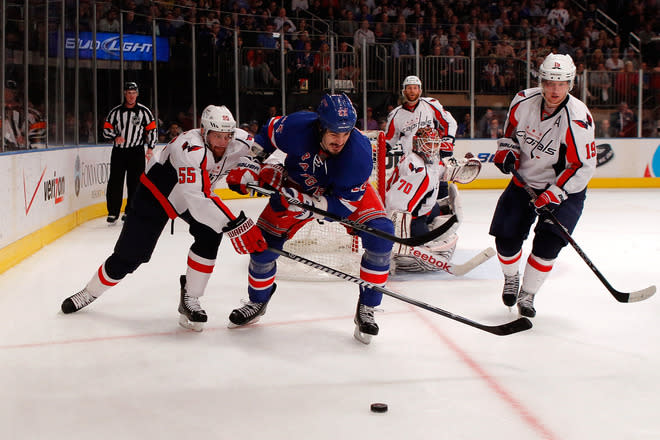   Brian Boyle #22 Of The New York Rangers Fights For The Puck In The Corner In The Secon Dperiod Against Jeff Halpern # Getty Images