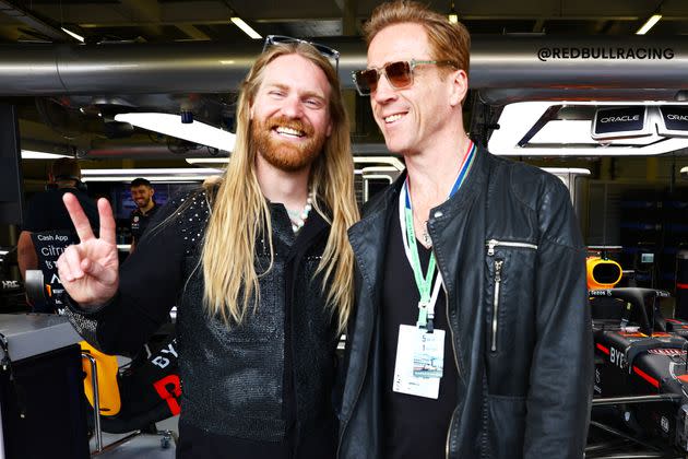 Sam Ryder and actor Damien Lewis pose for a photo outside the Red Bull Racing garage prior to the F1 Grand Prix of Great Britain at Silverstone July 3 in Northampton, England. (Photo: Mark Thompson via Getty Images)