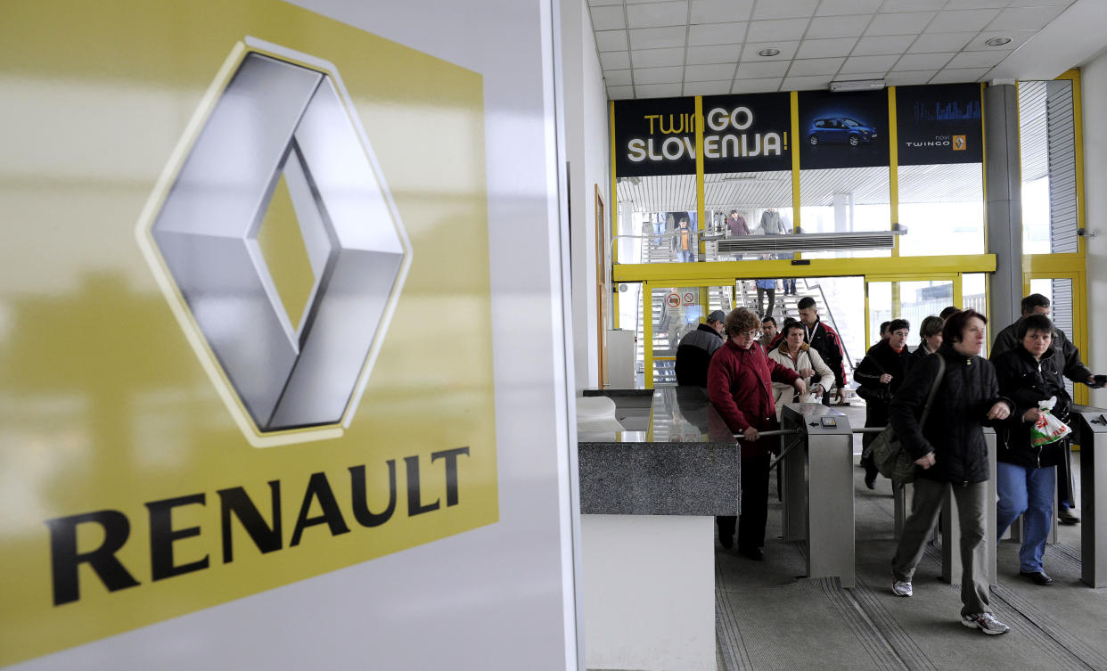 Workers leave the Revoz factory that produces cars for Renault in Novo Mesto March 24, 2009. Renault said it would build more older Clio II models at Flins near Paris to meet extra demand and because production at Novo Mesto in Slovenia had already been boosted to three shifts and could not be raised further. REUTERS/Srdjan Zivulovic(SLOVENIA BUSINESS POLITICS TRANSPORT IMAGE OF THE DAY TOP PICTURE)