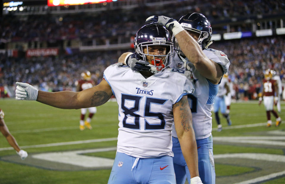Tennessee Titans tight end MyCole Pruitt (85) celebrates with tight end Anthony Firkser after Pruitt scored a touchdown on a 2-yard pass reception against the Washington Redskins in the second half of an NFL football game Saturday, Dec. 22, 2018, in Nashville, Tenn. (AP Photo/James Kenney)
