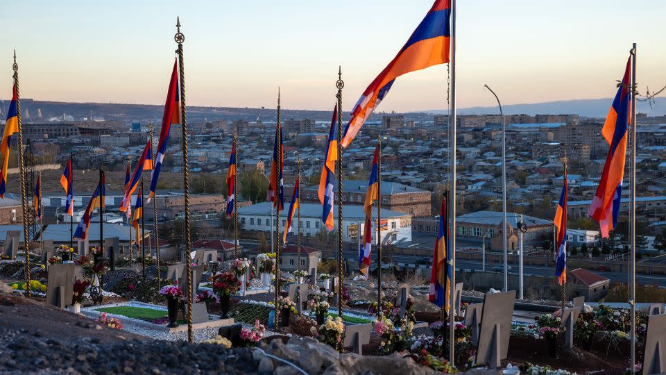 Karabakh flags fly in the Yerablur Military Cemetery in Yerevan, Armenia, above the graves of those killed during Azerbaijan's latest offensive, November 22, 2023. - Anthony Pizzoferrato/Middle East Images/AFP/Getty Images