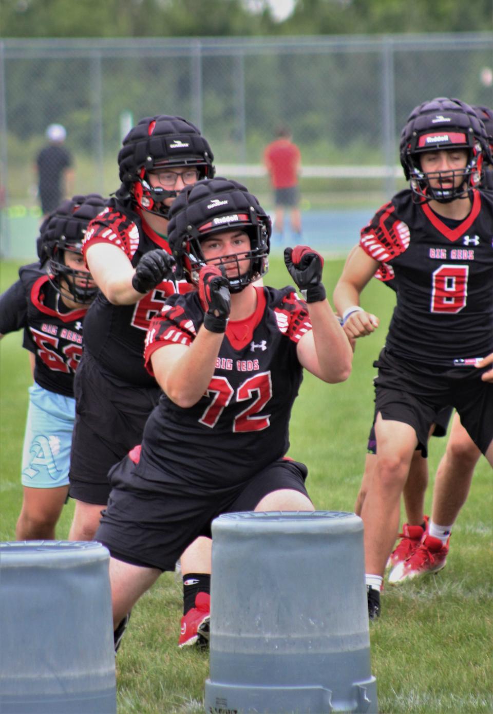 Milan lineman Brody Lopez works on defensive formations early in the morning on the opening day of football practice Monday, August 7, 2023.