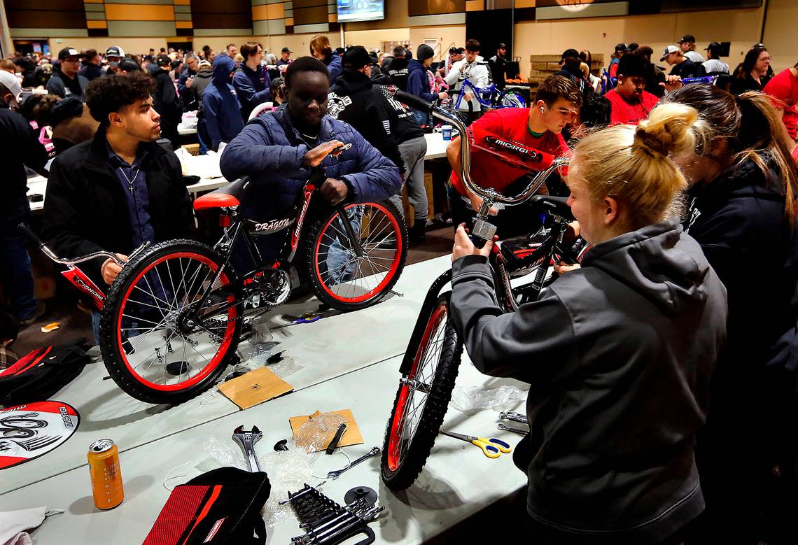 Students from Tri-Tech Skills Center join more than 600 volunteers at the 13th annual Bikes for Tikes bike build event at the Three Rivers Convention Center in Kennewick. The volunteers assembled 1,600 bicycles in about four hours for children in need throughout the Mid-Columbia. The Bikes for Tikes organization was founded in 2009 by the Plumbers & Steamfitters UA Local 598 and through this year have donated more than 18,500 bicycles.