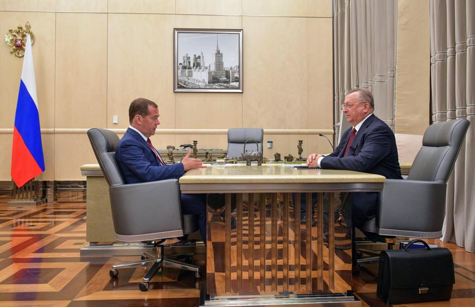 Russia's Prime Minister Dmitry Medvedev (L) and Nikolai Tokarev, chairman of the Board, president at Transneft, during a 2019 meeting.