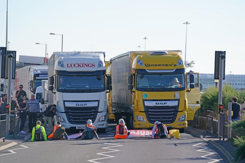 Protesters sit in front of lorries (Gareth Fuller/PA) (PA Wire)