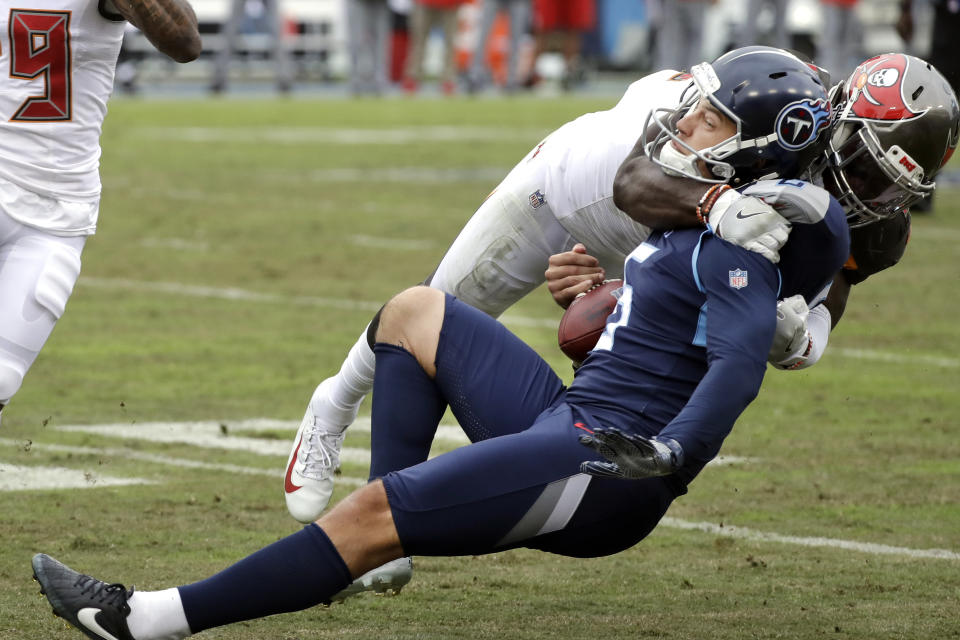 Tennessee Titans kick holder Brett Kern (6) is brought down by Tampa Bay Buccaneers linebacker Devin White on a fake field goal play in the second half of an NFL football game Sunday, Oct. 27, 2019, in Nashville, Tenn. (AP Photo/James Kenney)