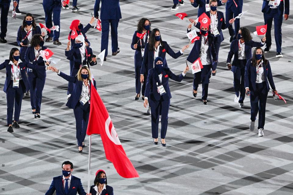 The athletes wore dark-colored suits