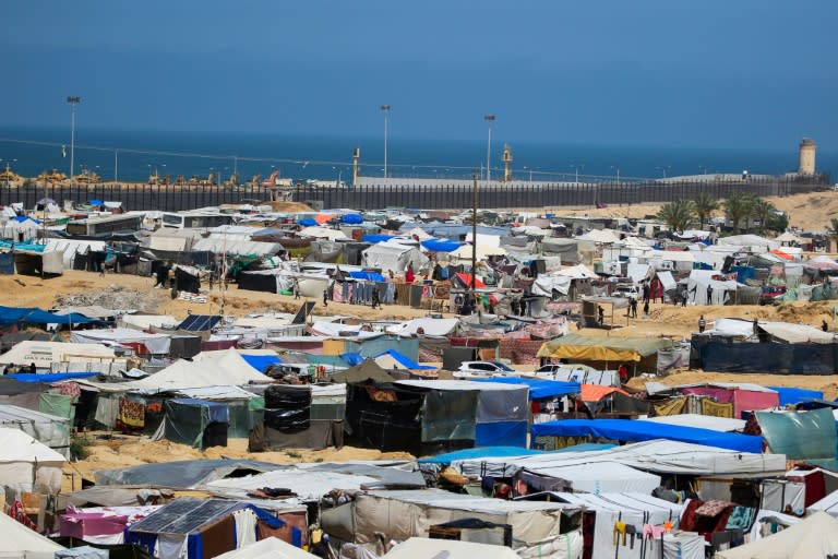 Al-Mawasi, where the field hispital is based, is an area of sand dunes on the Gaza coast that tens of thousands of displaced Palestinian civilians have turned into a vast tent city (-)