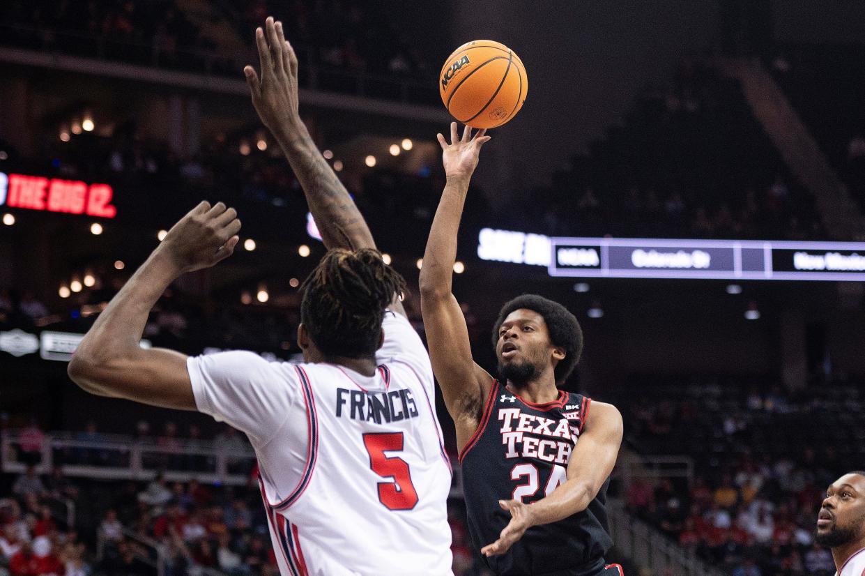 Texas Tech guard Kerwin Walton (24) shoots the ball while defended by Houston forward Ja'Vier Francis (5) during the semifinal round of the Big 12 Conference tournament game, Friday, March 15, 2024, in Kansas City, Mo.