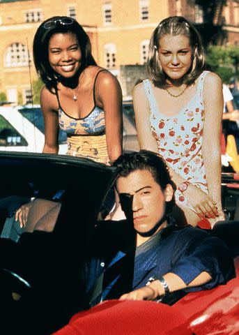 <p>Maximum Film / Alamy</p> Gabrielle Union, Larisa Oleynik and Andrew Keegan in '10 Things I Hate About You'
