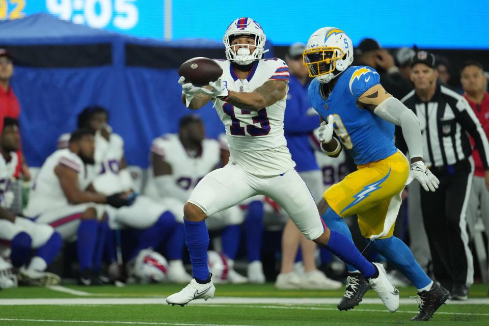Dec 23, 2023; Inglewood, California, USA; Buffalo Bills wide receiver Gabe Davis (13) catches a 57-yard touchdown pass against the Los Angeles Chargers in the first half at SoFi Stadium. Mandatory Credit: Kirby Lee-USA TODAY Sports